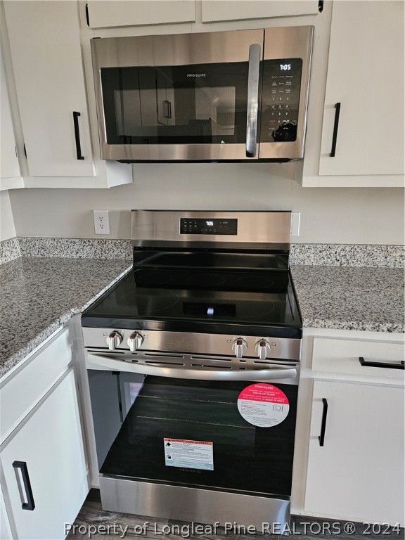 3458 Popes Crossing Road Lumberton, NC 28358 - Photo 12 of 50 a stove top oven sitting inside of a kitchen