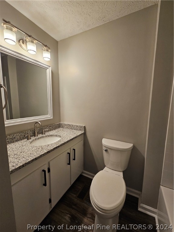 3458 Popes Crossing Road Lumberton, NC 28358 - Photo 37 of 50 a bathroom with a granite countertop toilet a mirror and a sink
