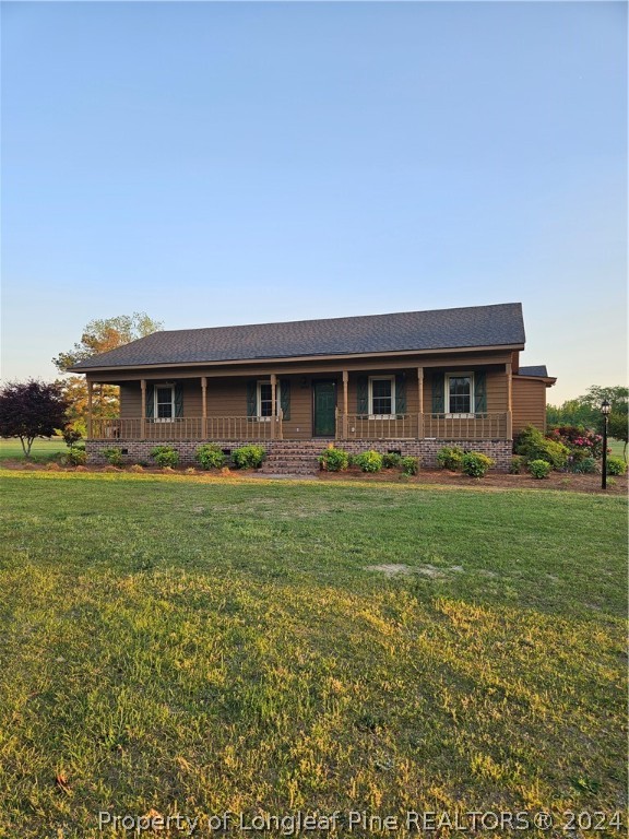 3458 Popes Crossing Road Lumberton, NC 28358 - Photo 46 of 50 a front view of a house with a yard
