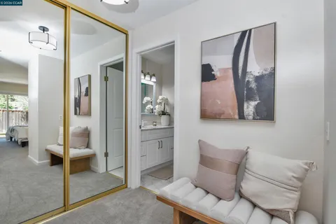 a room with furniture and view of bathroom