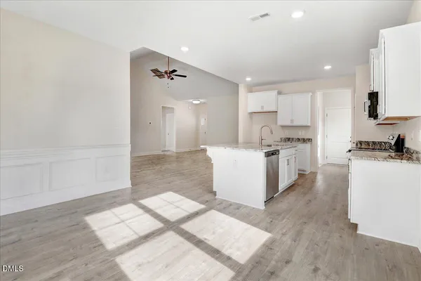 a kitchen with a stove and a sink