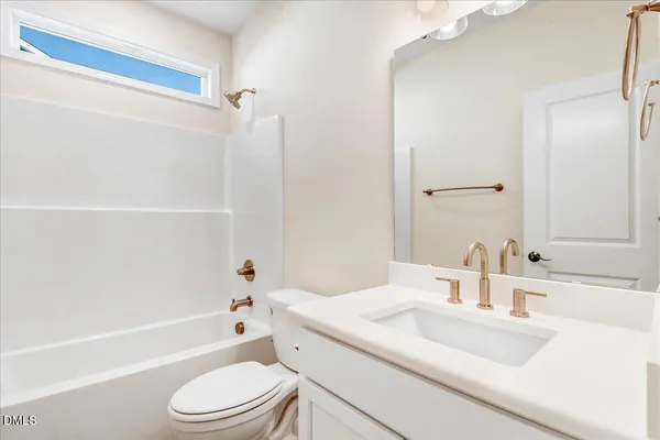 a bathroom with a double vanity sink and mirror