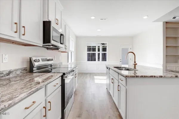 a kitchen with a sink and cabinets