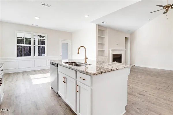 a kitchen with stainless steel appliances granite countertop a sink stove oven a sink and dishwasher with cabinets