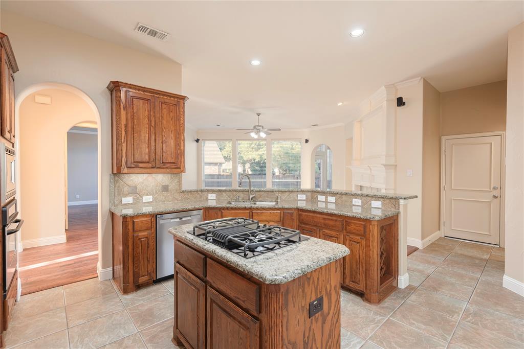 1404 Rio Grande Drive Allen, TX 75013 - Photo 16 of 40 a kitchen with a stove and a sink