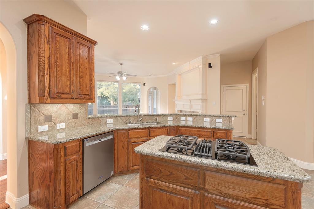 1404 Rio Grande Drive Allen, TX 75013 - Photo 18 of 40 a kitchen with a sink stove and cabinets