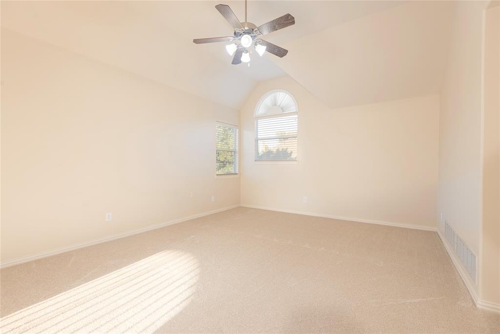 1404 Rio Grande Drive Allen, TX 75013 - Photo 26 of 40 an empty room with a window and a fan