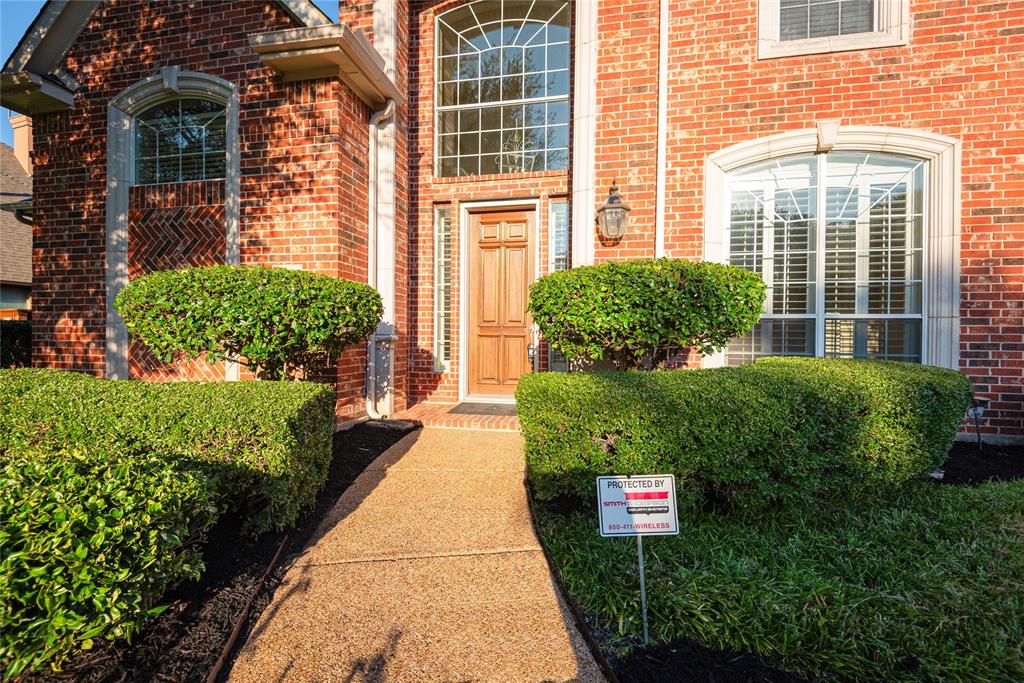 1404 Rio Grande Drive Allen, TX 75013 - Photo 3 of 40 a front view of a house with a yard