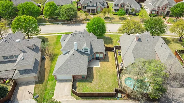 an empty room with a window and a ceiling fan
