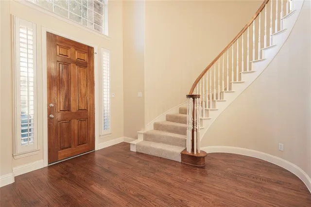 a view of entryway with wooden floor