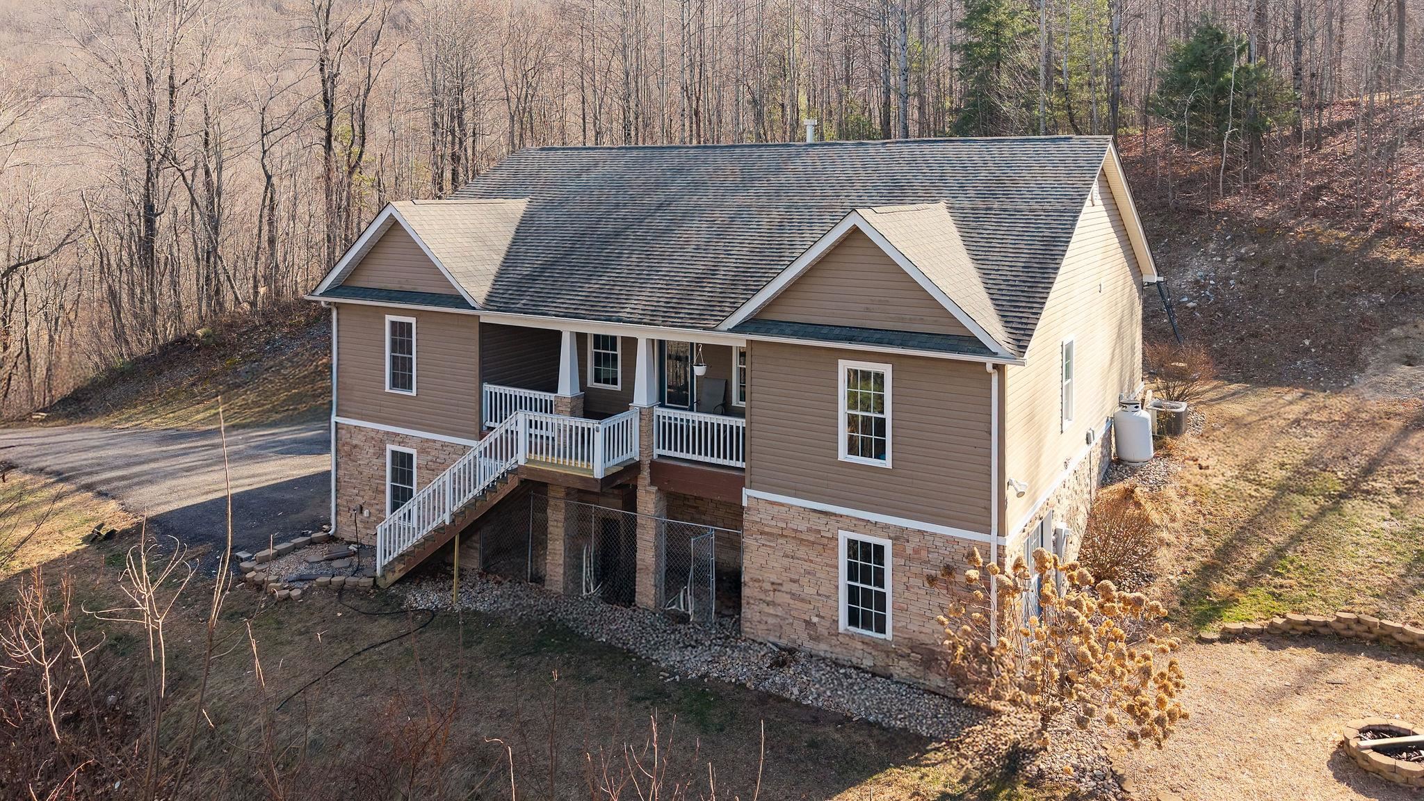 467 Reeds Gap Road Lyndhurst, VA 22952 - Photo 1 of 42 a aerial view of a house next to a yard
