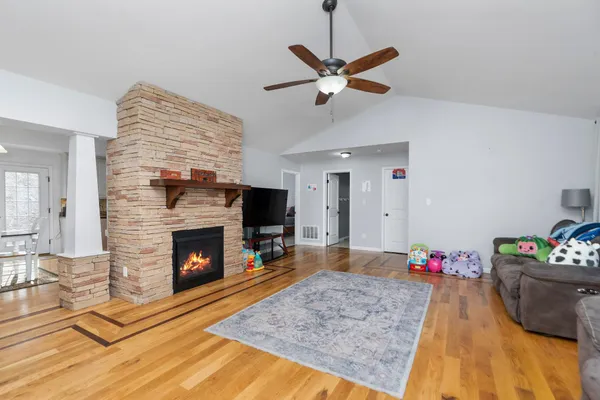 a living room with furniture and a fireplace