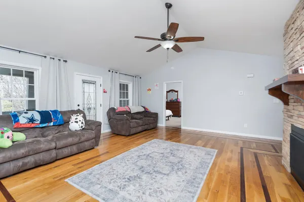 a living room with furniture and a rug