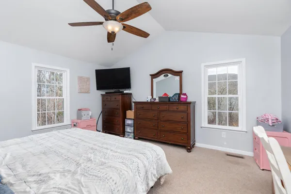 a bedroom with a bed and a cabinets