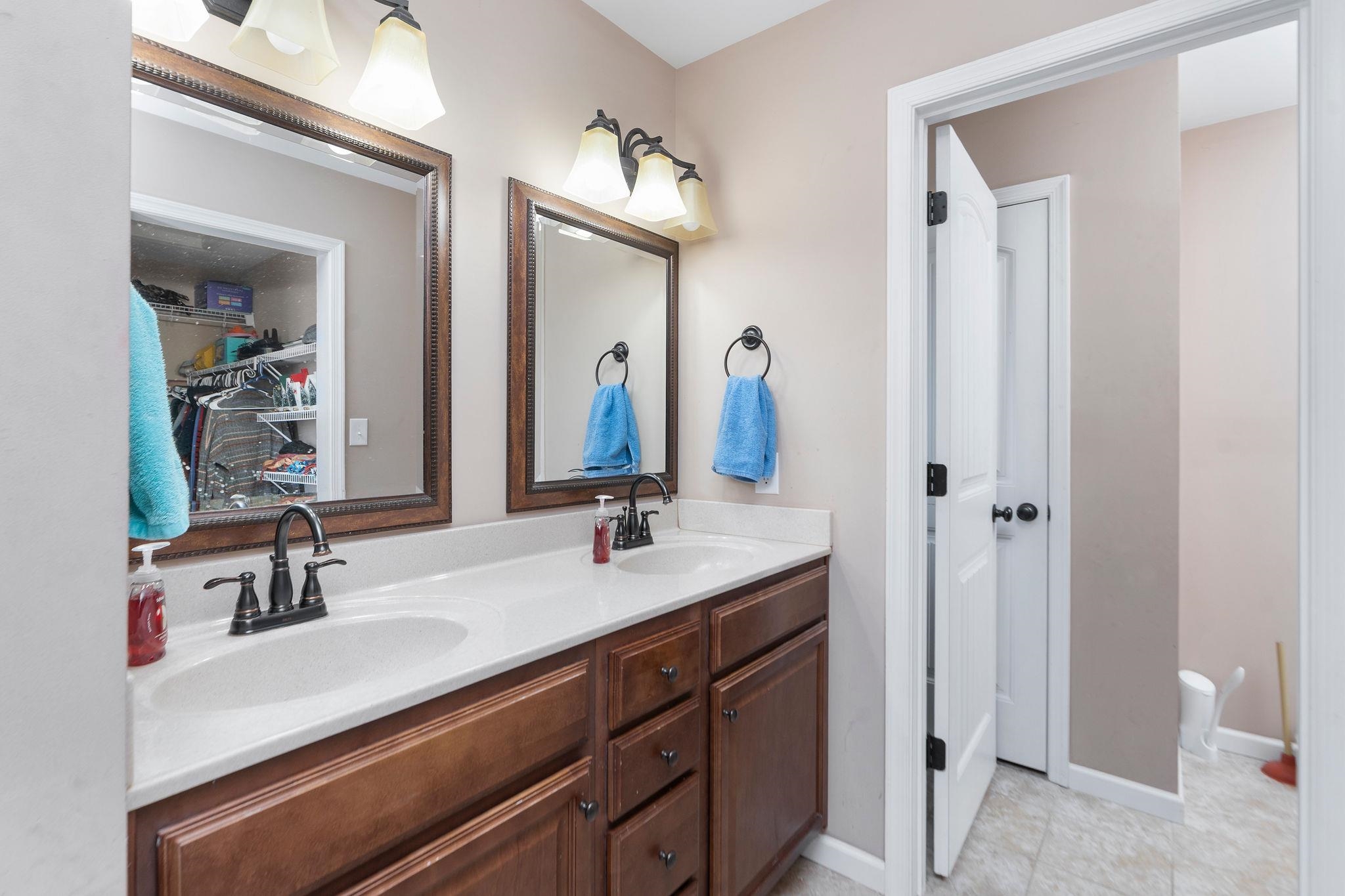 467 Reeds Gap Road Lyndhurst, VA 22952 - Photo 19 of 42 a bathroom with a sink double vanity and a mirror