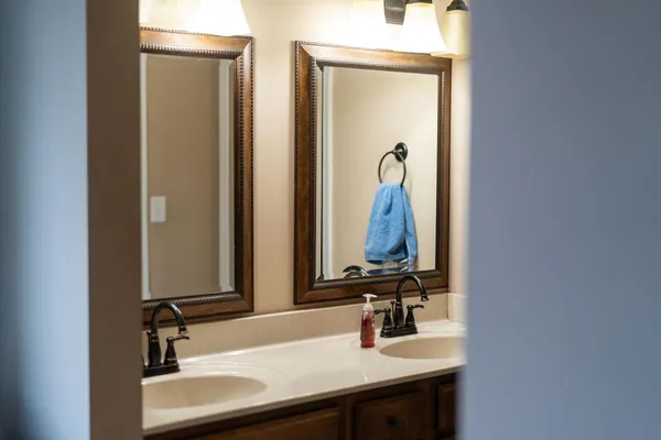 a white toilet sitting next to a shower