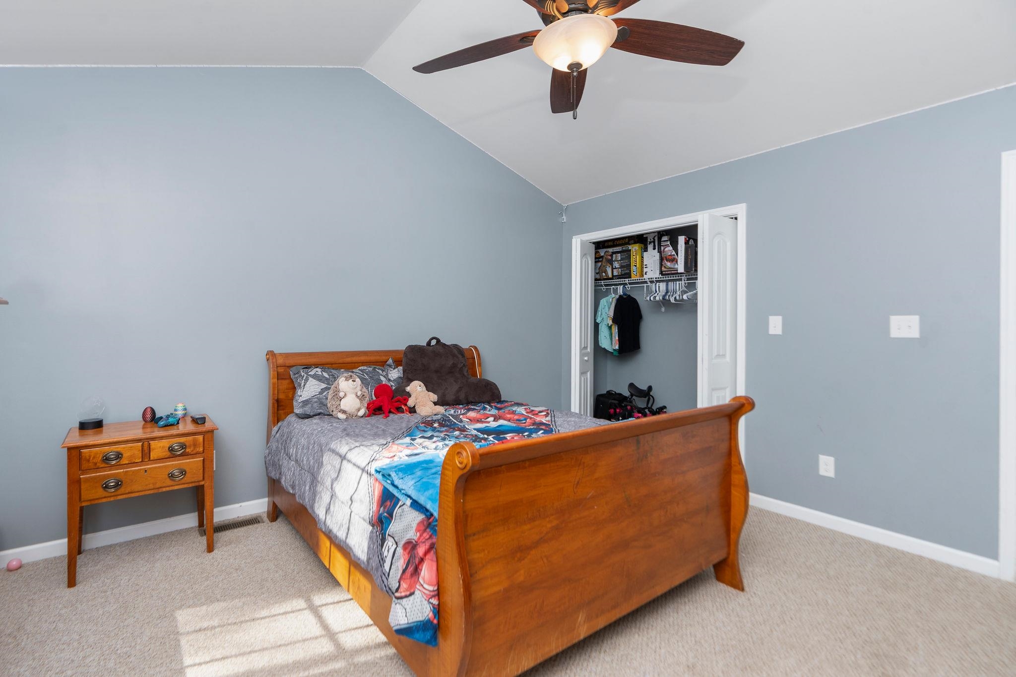 467 Reeds Gap Road Lyndhurst, VA 22952 - Photo 28 of 42 a bedroom with a bed and a chandelier
