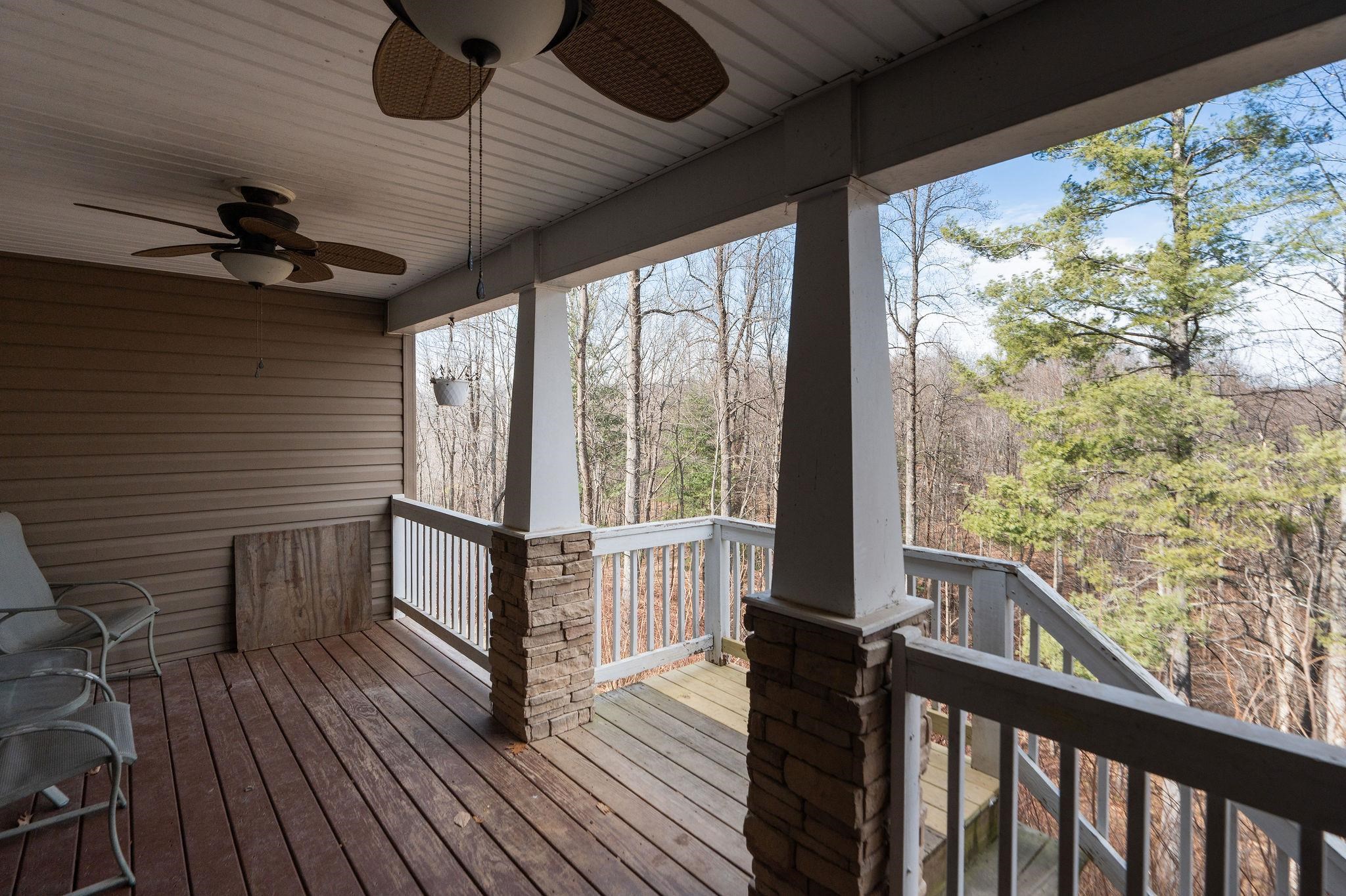 467 Reeds Gap Road Lyndhurst, VA 22952 - Photo 34 of 42 a view of a balcony with wooden floor and iron stairs