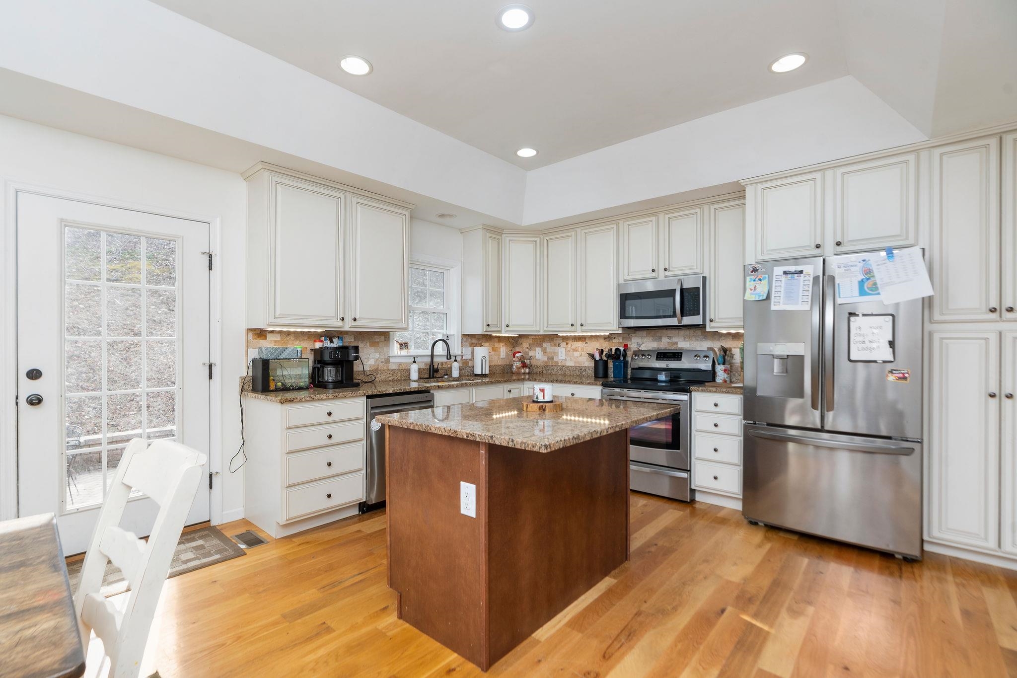 467 Reeds Gap Road Lyndhurst, VA 22952 - Photo 5 of 42 a kitchen with stainless steel appliances granite countertop a refrigerator stove a sink and a microwave