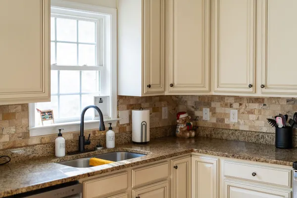 a kitchen with a sink and cabinets