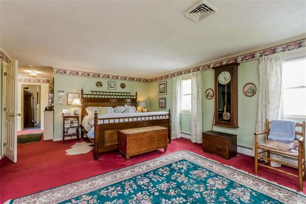 21 Schooner Ridge Marblehead, MA 01945 - Photo 15 of 30 a bedroom with furniture and a fireplace