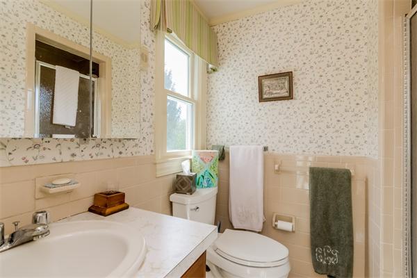 21 Schooner Ridge Marblehead, MA 01945 - Photo 20 of 30 a bathroom with a sink a toilet and shower curtain