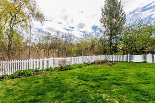 21 Schooner Ridge Marblehead, MA 01945 - Photo 29 of 30 a view of a yard with a fence and trees