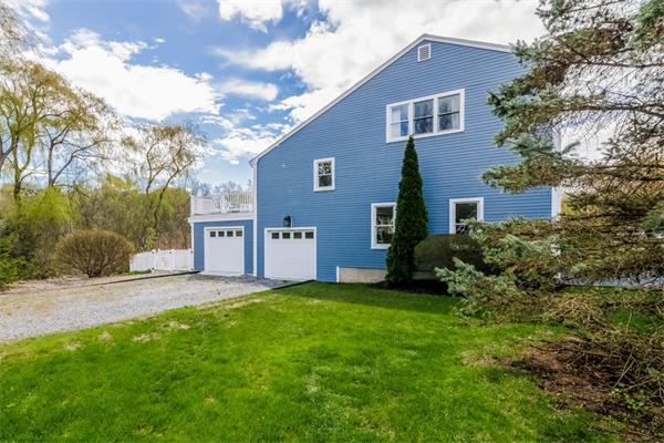 21 Schooner Ridge Marblehead, MA 01945 - Photo 30 of 30 a front view of a house with a yard and garage