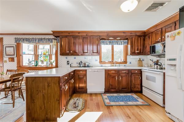 21 Schooner Ridge Marblehead, MA 01945 - Photo 8 of 30 a kitchen with granite countertop a stove top oven sink and cabinets