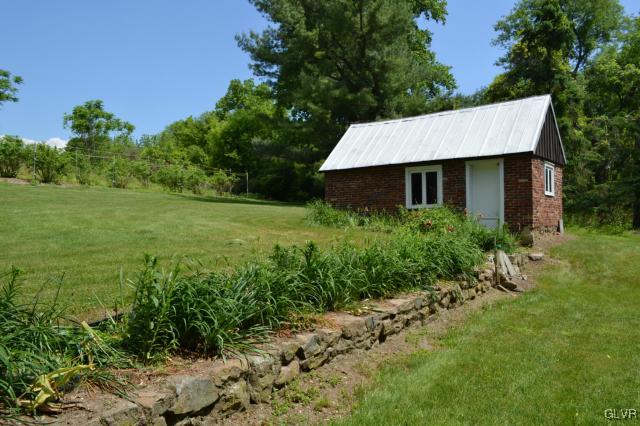 460 Gower Road Nazareth, PA 18064 - Photo 8 of 37 a backyard of a house with plants and large trees