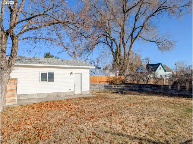 a view of a house with a snow in the yard