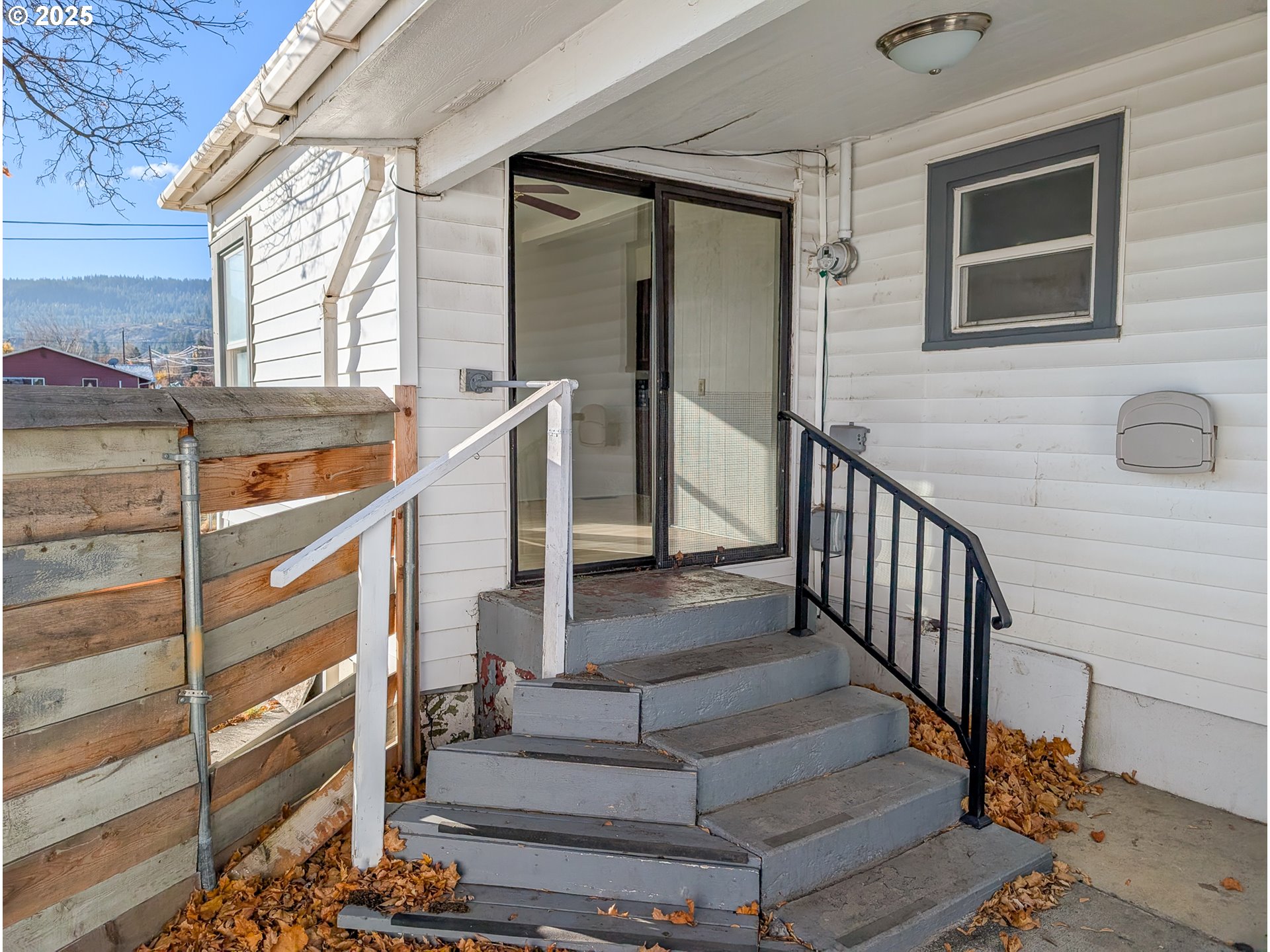 901 2nd Street La Grande, OR 97850 - Photo 16 of 19 a view of staircase with lots of frames on wall and a large window
