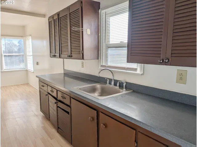 a kitchen with a sink and a window