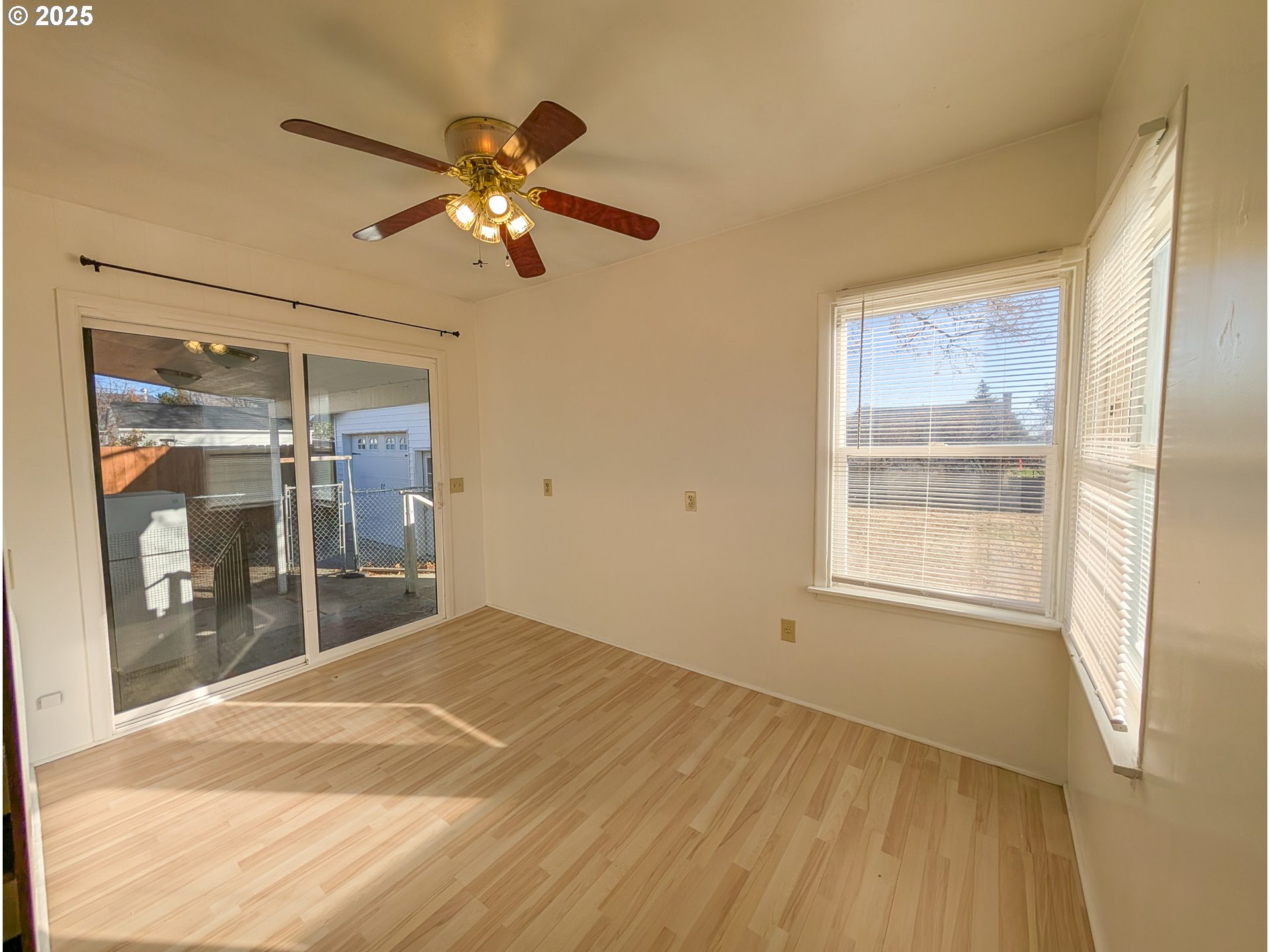 901 2nd Street La Grande, OR 97850 - Photo 7 of 19 a view of empty room with wooden floor and fan