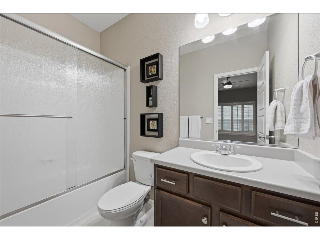6096 Story Road Timnath, CO 80547 - Photo 31 of 50 a bathroom with a sink a toilet and shower