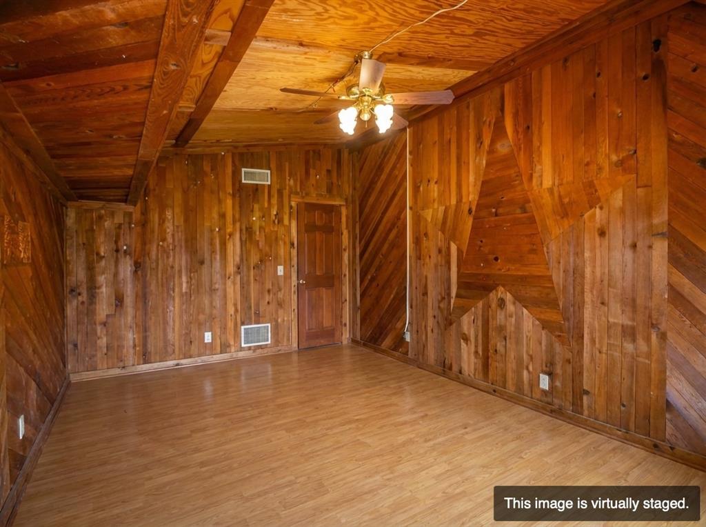 250 Mail Rte Road Fischer, TX 78623 - Photo 13 of 29 a view of an empty room with wooden walls