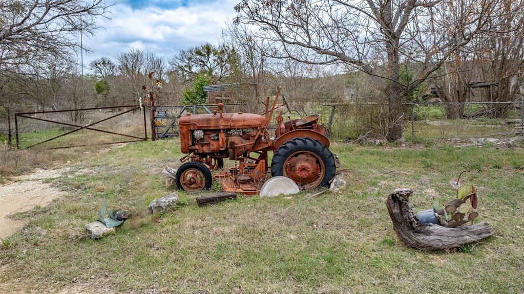 250 Mail Rte Road Fischer, TX 78623 - Photo 20 of 29 a view of a backyard with wooden fence