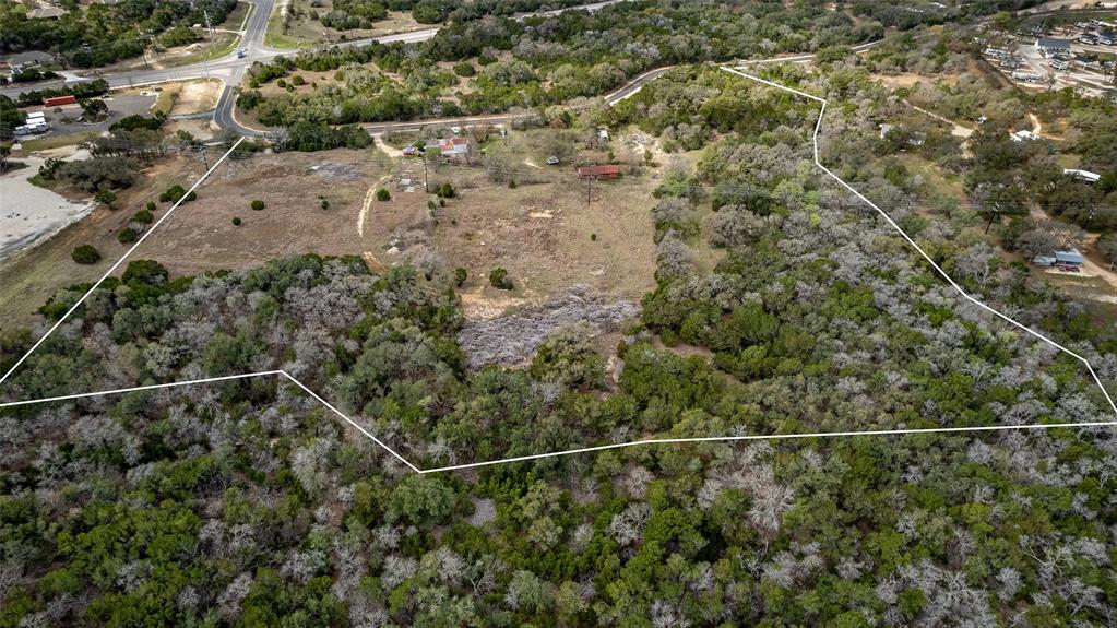 250 Mail Rte Road Fischer, TX 78623 - Photo 22 of 29 a view of a yard with wooden floor and fence