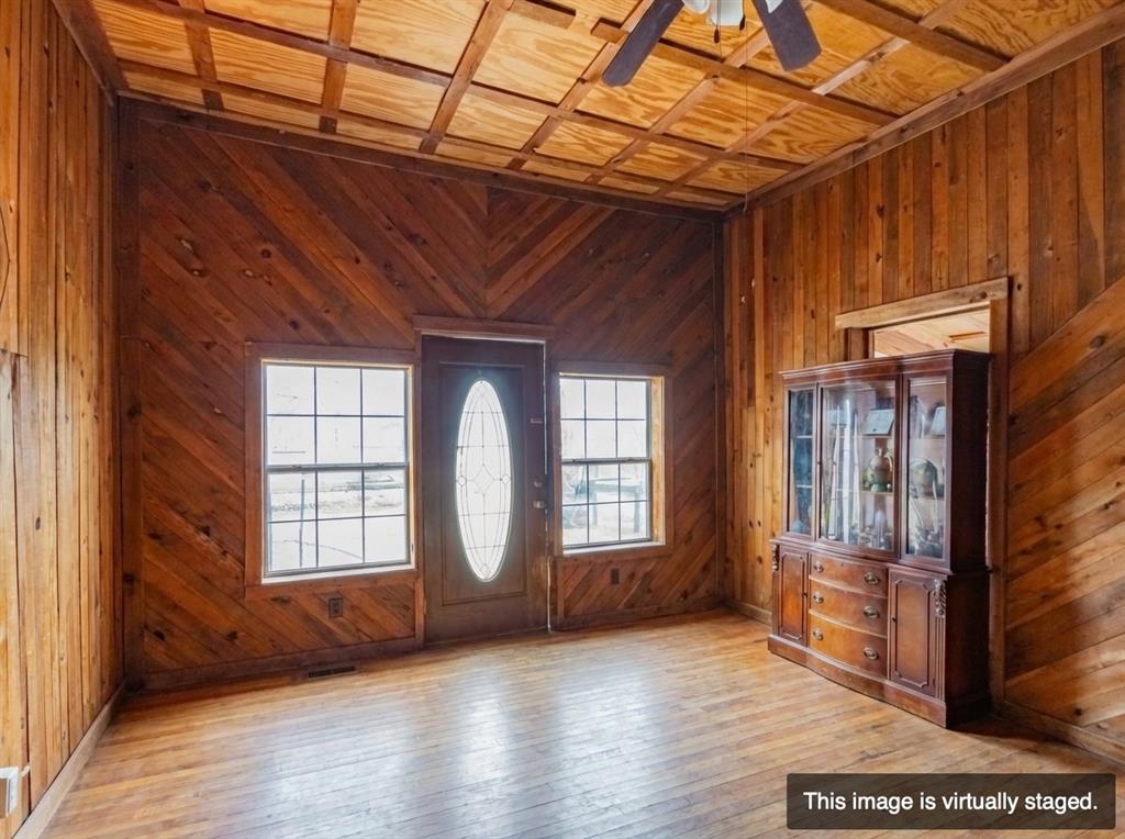 250 Mail Rte Road Fischer, TX 78623 - Photo 10 of 29 a view of empty room with wooden floor and fan