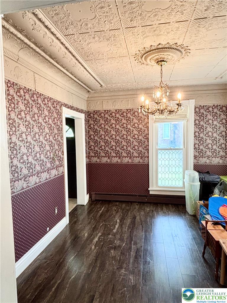 7241 Decatur Street New Tripoli, PA 18066 - Photo 10 of 36 Ornate pressed tin ceilings and decorative moldings define this generously sized room, ready for your personal touch.