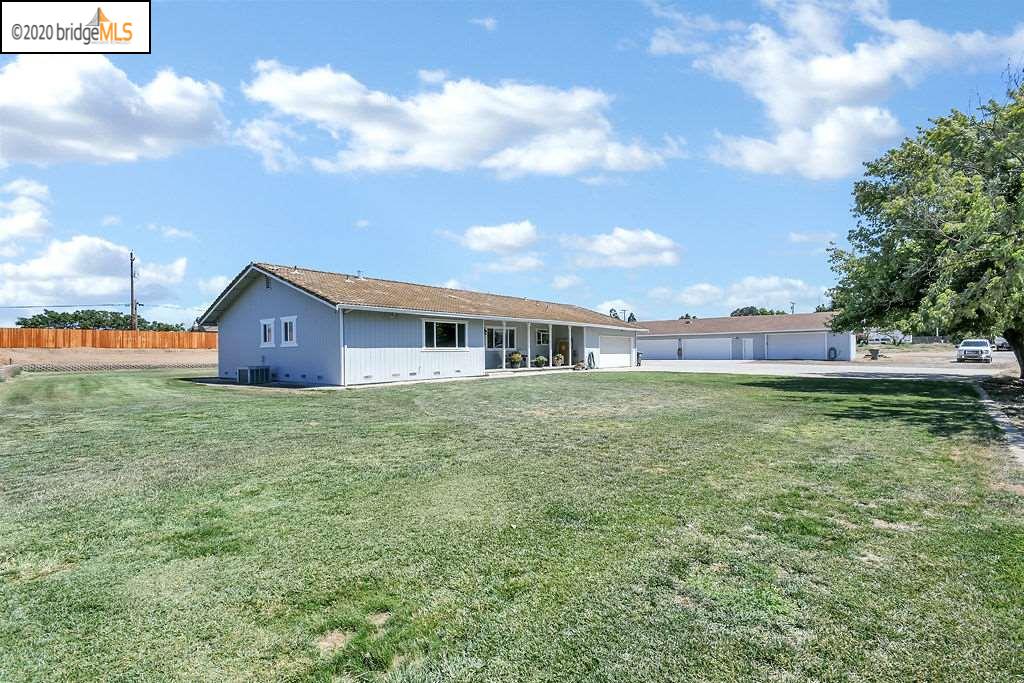 NW corner of the property, showing home and detached garage.