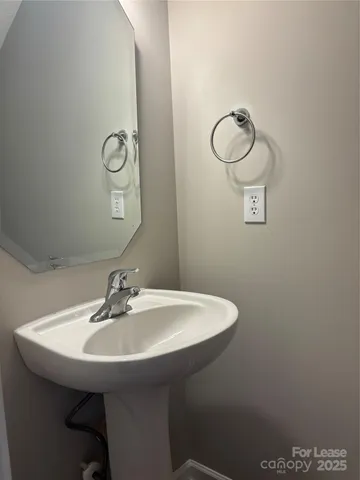 a bathroom with a sink and mirror