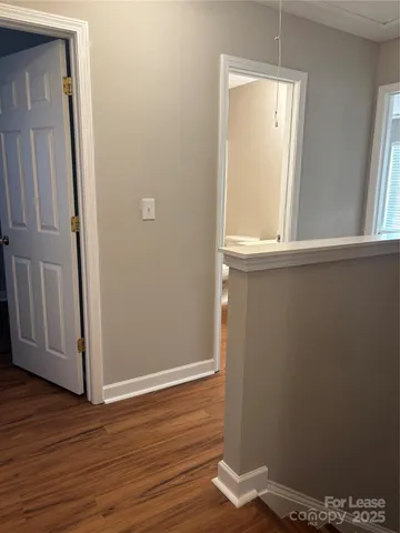 a view of front door with wooden floor