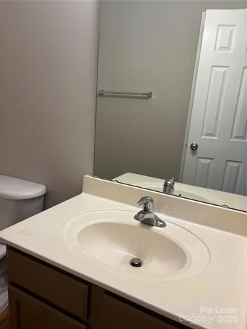 a bathroom with a sink and a toilet