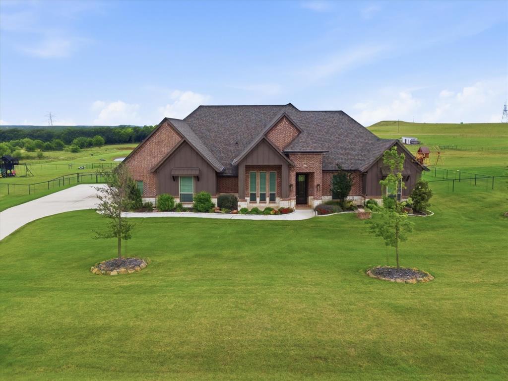 150 Quail Ridge Decatur, TX 76234 - Photo 3 of 32 a house view with a garden space