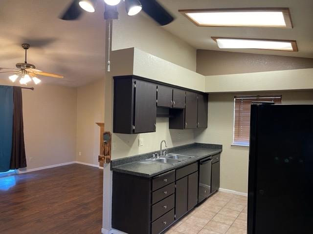 1240 Seneca Drive Madera, CA 93637 - Photo 2 of 21 a kitchen with a sink cabinets and wooden floor