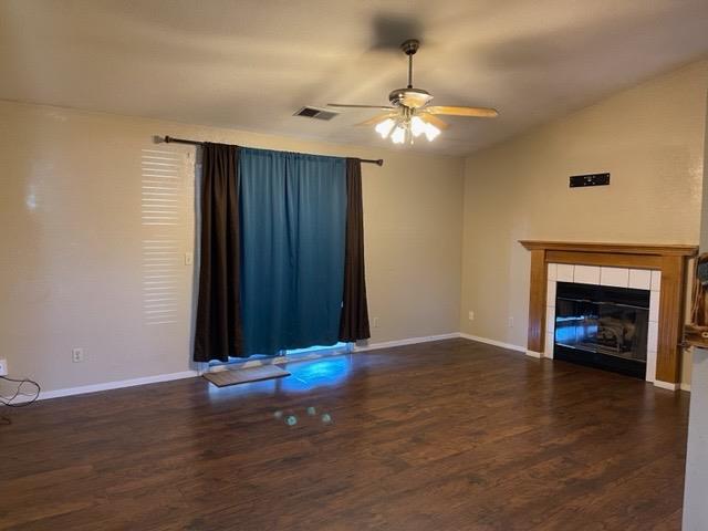 1240 Seneca Drive Madera, CA 93637 - Photo 6 of 21 a view of an empty room with wooden floor fireplace and a window