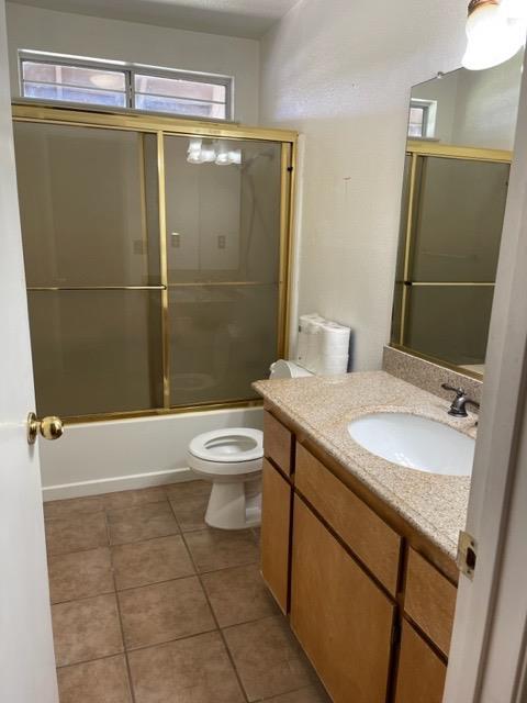 1240 Seneca Drive Madera, CA 93637 - Photo 8 of 21 a bathroom with a sink toilet and shower