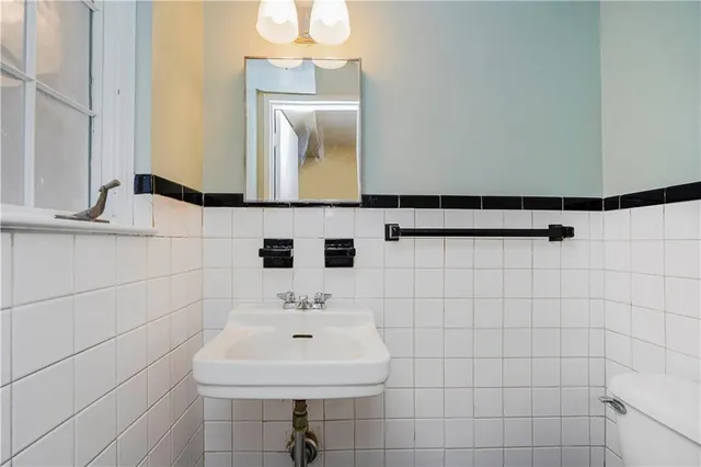 a bathroom with a sink and mirror