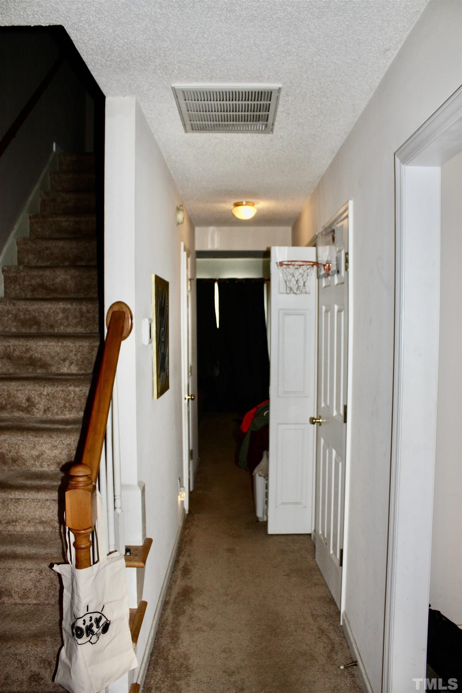 4702 Tanglewood Oaks Street Raleigh, NC 27610 - Photo 4 of 11 a view of hallway with furniture and entryway